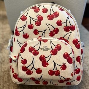 Coach Court Cream Backpack with Red Cherry Print